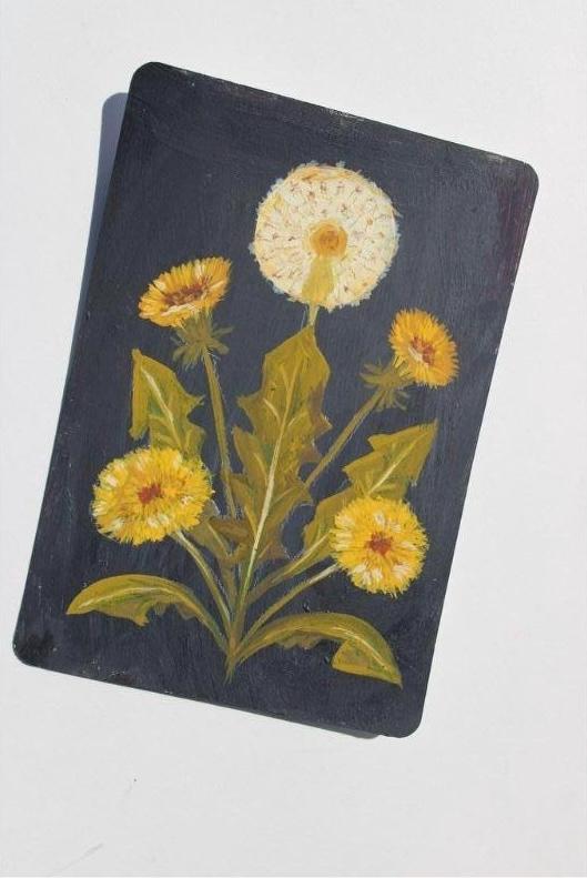 Notebook with dandelion design on a white background