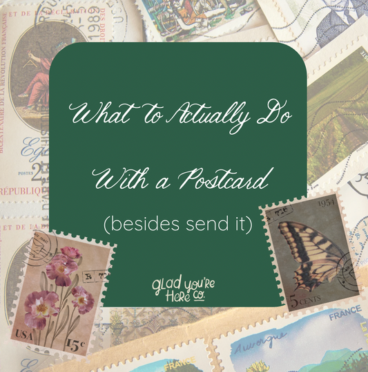 Vintage postage stamps from France and USA scattered as background with text overlay reading "What to Actually Do With a Postcard (besides send it)"