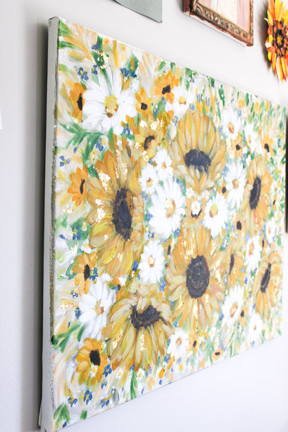 Painting of sunflowers on a white wall