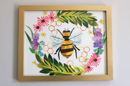 Framed artwork with a bee and floral design on a white background