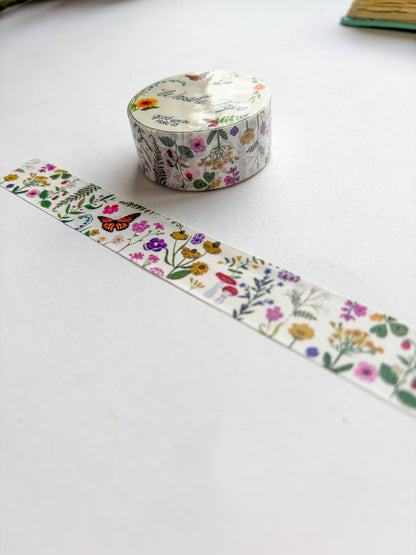 Decorative washi tape with floral design on a white surface