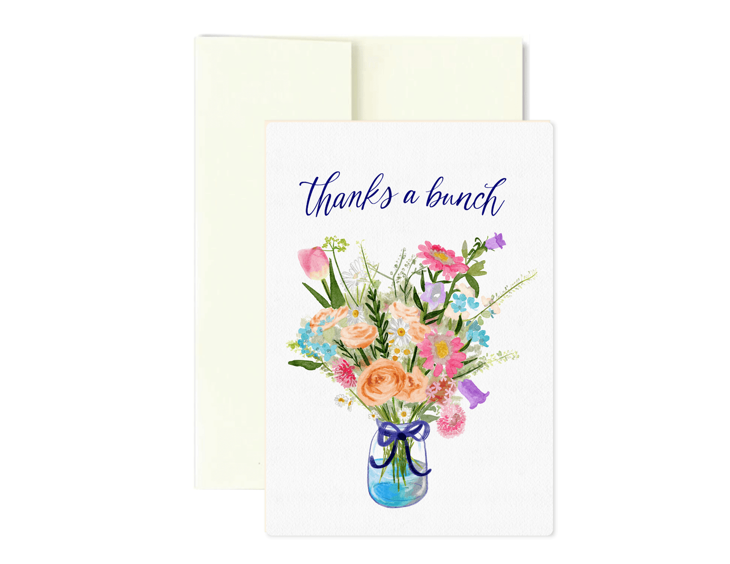 A white greeting card with the phrase 'thanks a bunch' in blue script above a watercolor bouquet of pink, peach, purple, and blue flowers in a glass jar, shown with a cream envelope behind it on a white background.