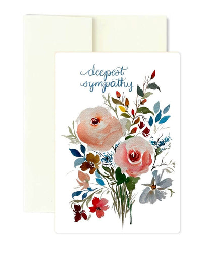 A sympathy greeting card with the words 'deepest sympathy' in blue script above a watercolor bouquet of pink roses and wildflowers, shown with a cream envelope behind it on a white background.