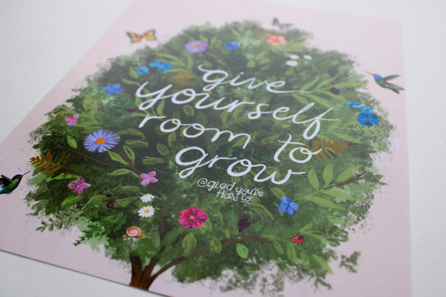 Card with a tree illustration and 'give yourself room to grow' text on a white background