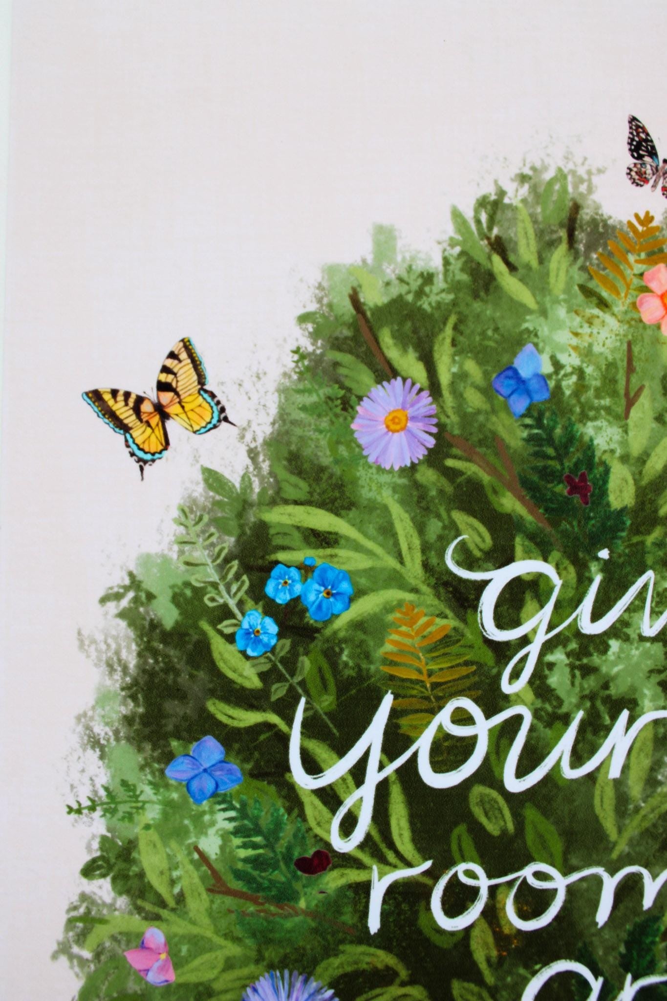 Decorative wall art with greenery, flowers, and butterflies on a white background.