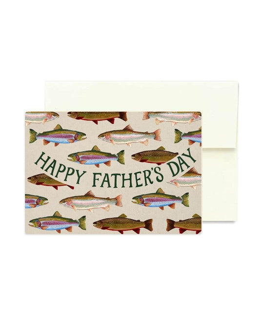 A Father's Day greeting card with a pattern of illustrated fish on a cream background and the words 'HAPPY FATHER'S DAY' in dark green script, shown with a matching cream envelope behind it.