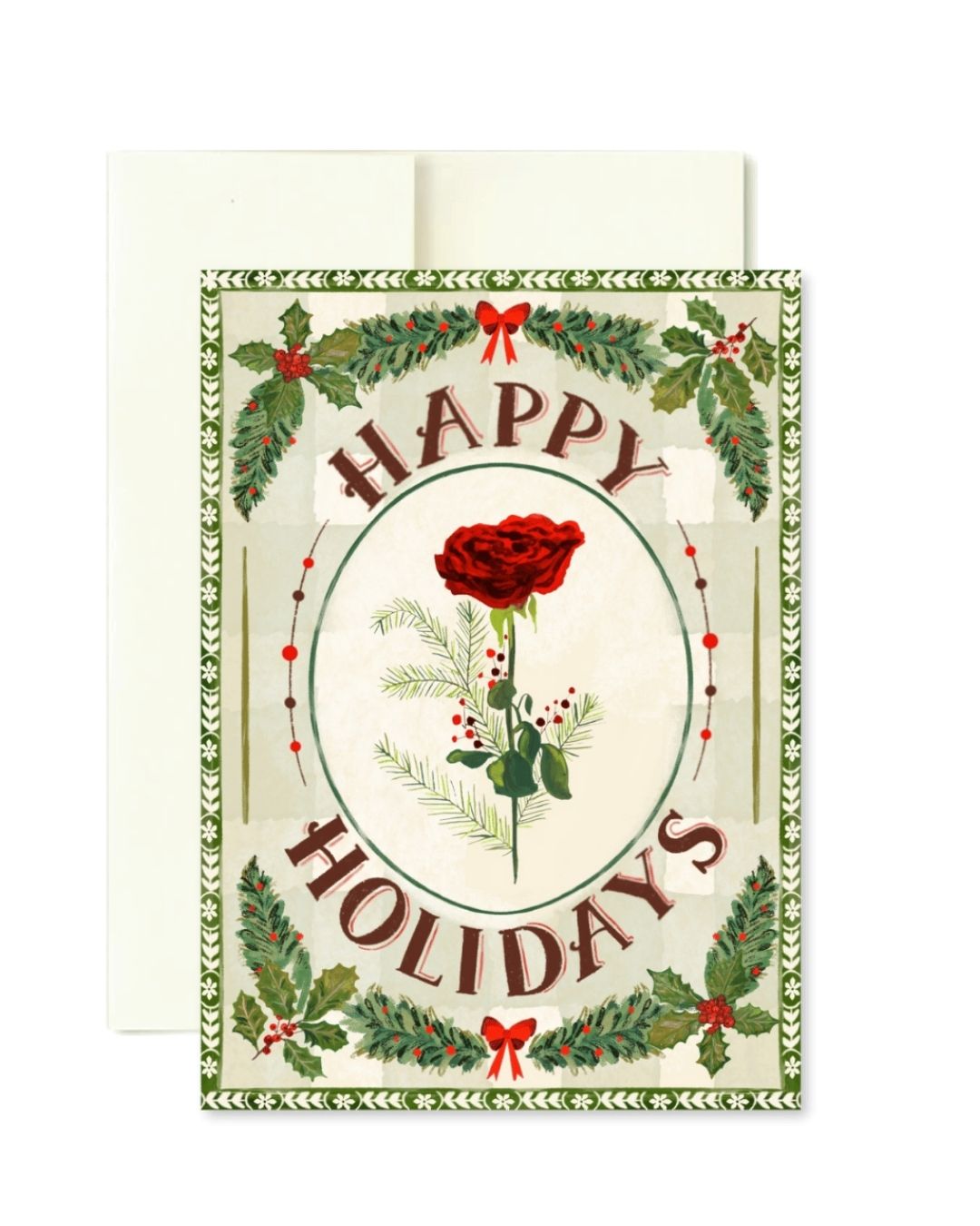 A vintage-style holiday greeting card with an envelope behind it. The card features a cream background, a central red rose inside an oval, the words “HAPPY HOLIDAYS” in arched brown lettering, and a border of green holly leaves and red berries.