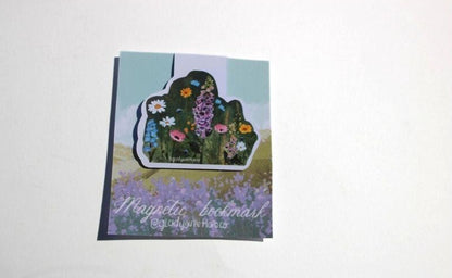 Magnetic bookmark on floral backing with  wildflower flowers design on a white background