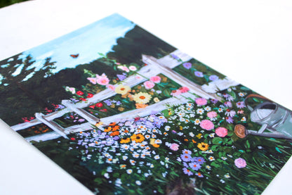 Garden scene with flowers and a bench on a postcard