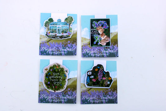 Four decorative magnets with nature-themed designs on a white background