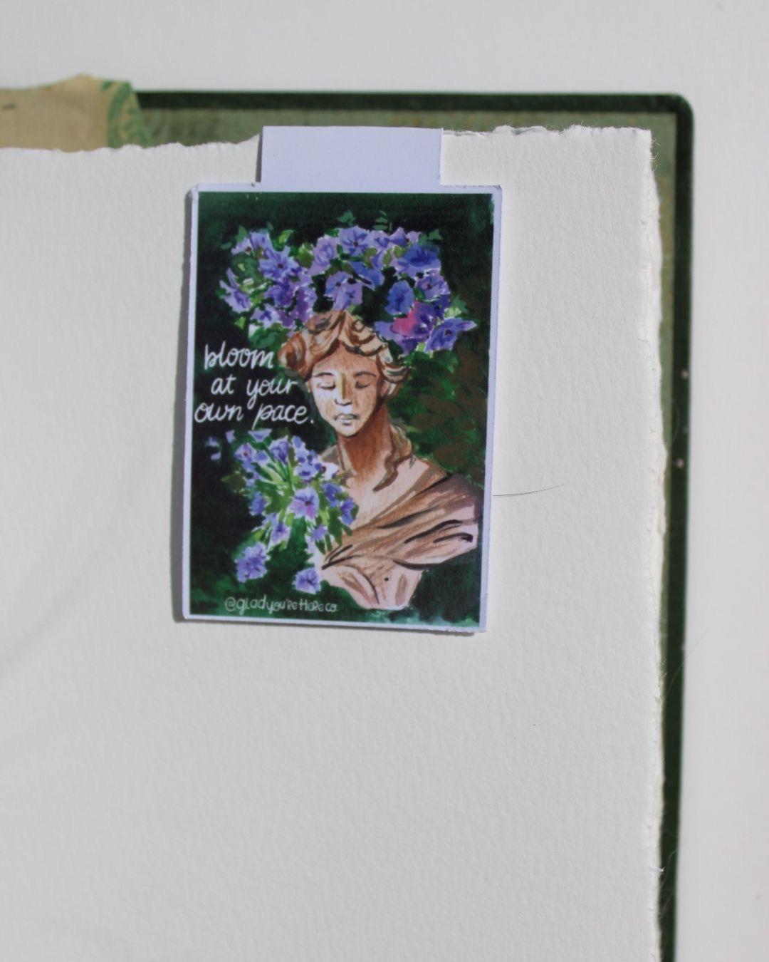 Artistic depiction of a woman with floral crown on a textured white background