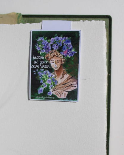 Artistic depiction of a woman with floral crown on a textured white background