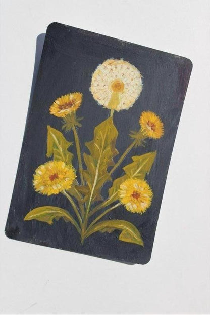 Notebook with dandelion design on a white background
