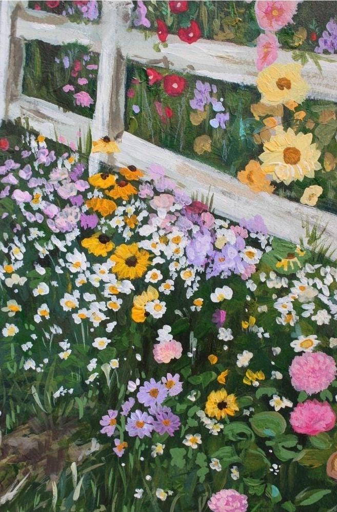 Colorful garden scene with flowers and a wooden fence