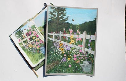 Two postcards with garden scenes featuring flowers and a white picket fence.