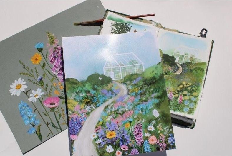 Four notebooks with garden and floral designs on a white background