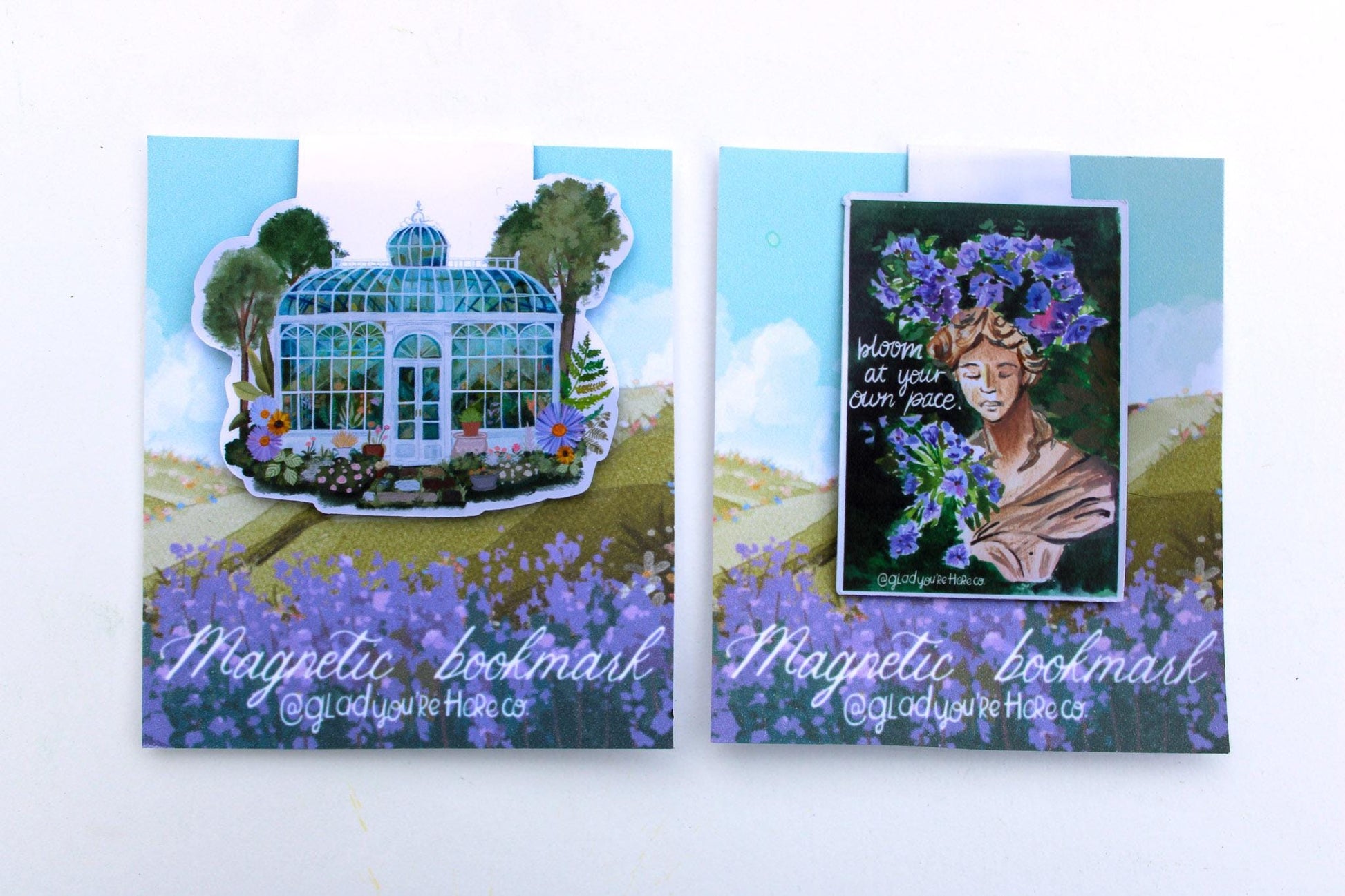 Two magnetic bookmarks with illustrations of a greenhouse and a woman with flowers, on a white background.