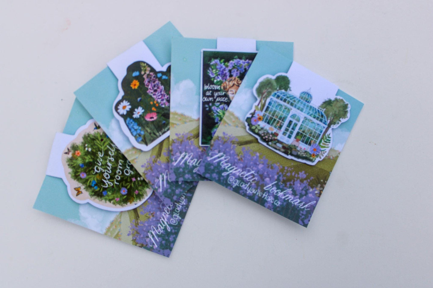 Set of greeting cards with garden-themed designs on a light gray background