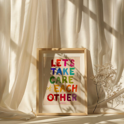 Framed colorful text art with 'Let's Take Care of Each Other' on a neutral background