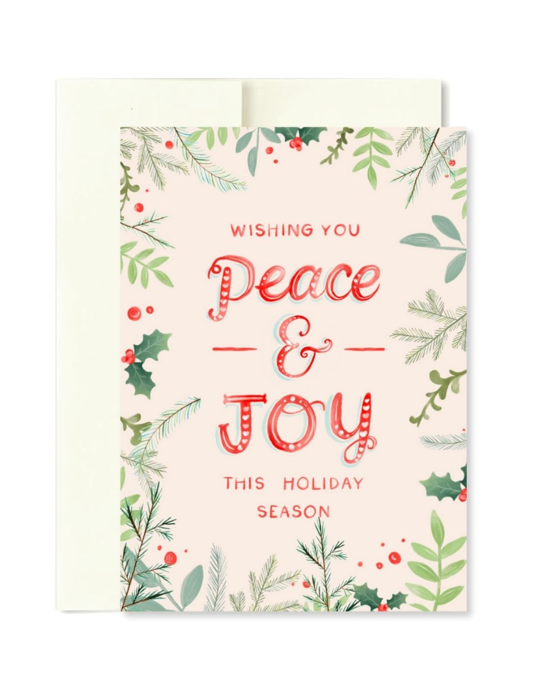 A festive holiday greeting card with an envelope behind it. The card has a pale pink background with watercolor-style green foliage, red berries, and red lettering that reads 'Wishing You Peace & Joy This Holiday Season.