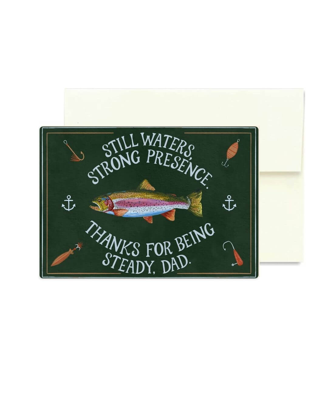 A rectangular dark green greeting card with a trout illustration and fishing-themed text reading 'Still Waters Strong Presence Thanks for Being Steady, Dad,' shown with a plain white envelope behind it on a white background.