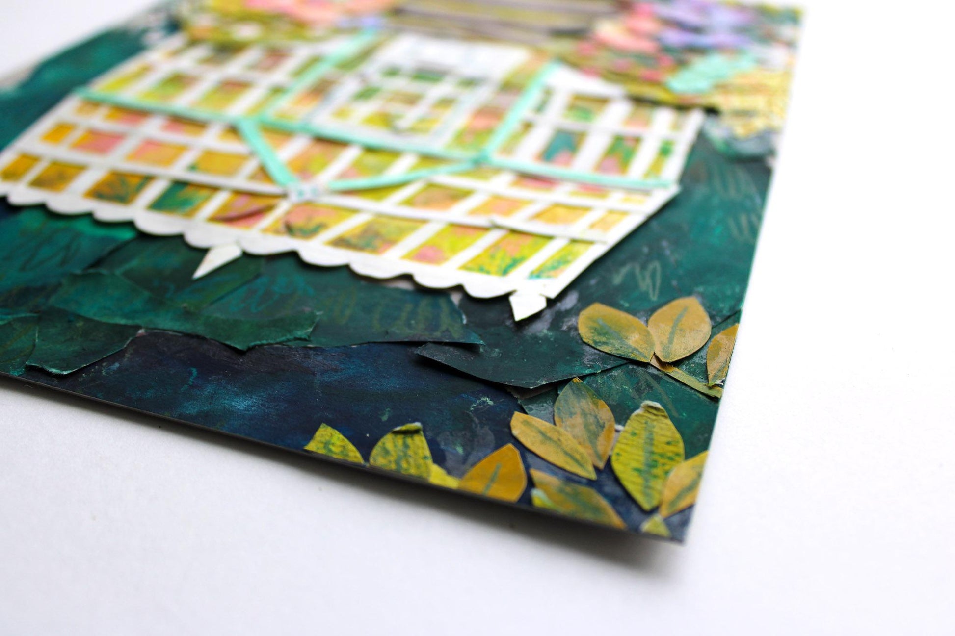 Close-up of a textured paper with colorful patterns on a white background